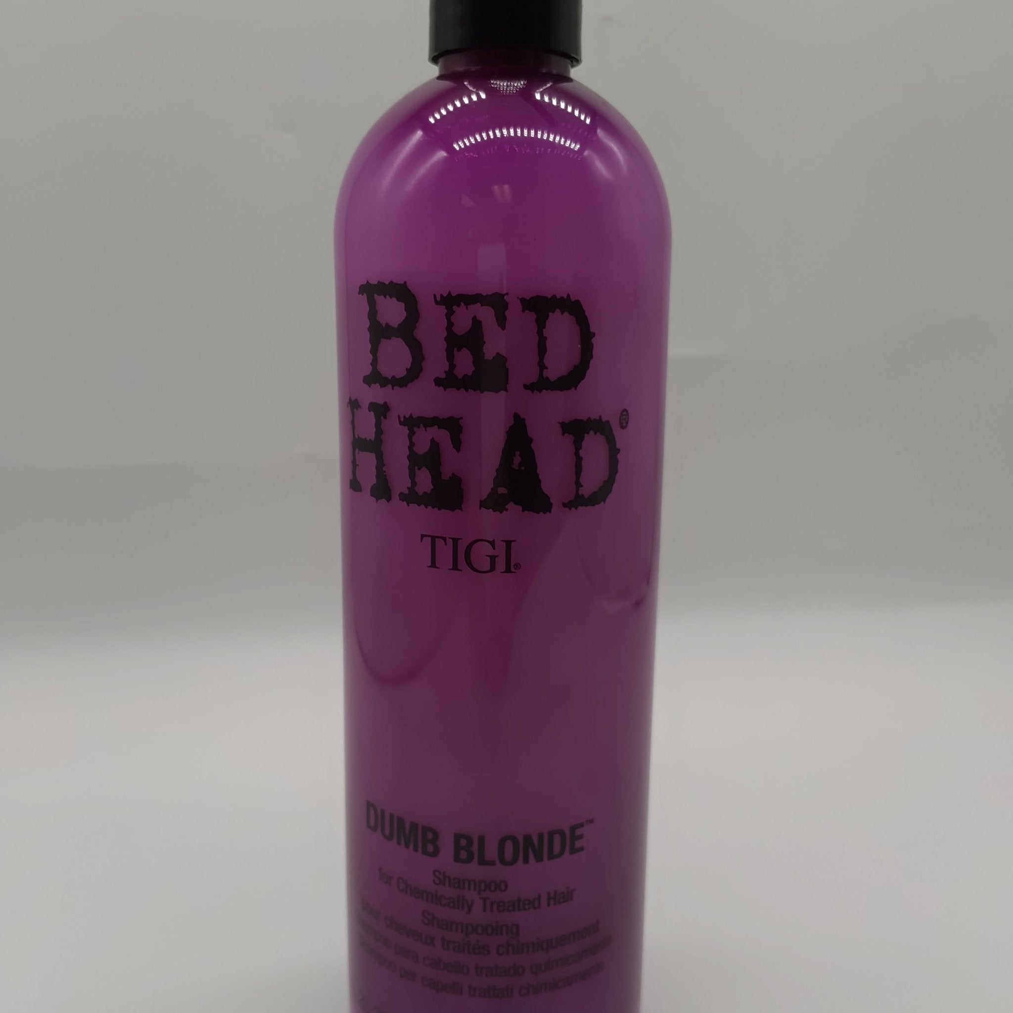 TIGI Bed Head Dumb Blonde Shampoo bottle for brightening blonde hair.