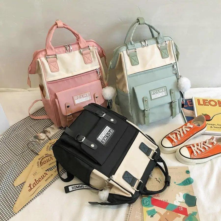 Preppy patchwork laptop backpack with cute ring detail and internal padded compartment.