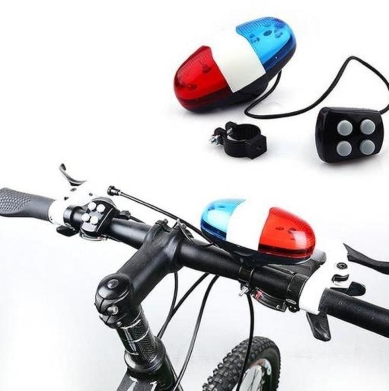 Waterproof multifunction bike lamp with blue and red LED strobe lights and integrated safety siren mounted on a bicycle handlebar.
