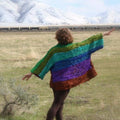 Colorful crochet kimono duster jacket featuring a unique funky pattern layered over casual clothing