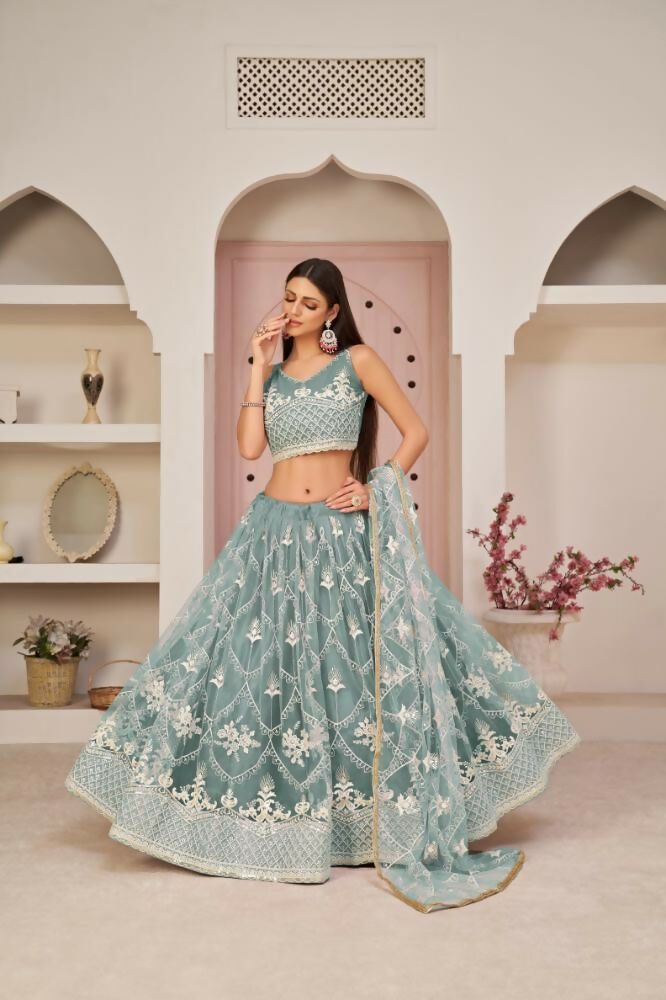 Ocean Blue butterfly net lehenga featuring intricate white cotton thread and sequin embroidery.