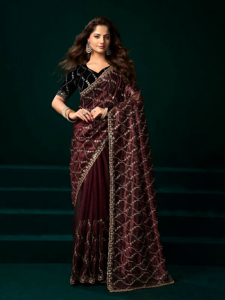 Maroon net party wear saree with contrasting black velvet blouse