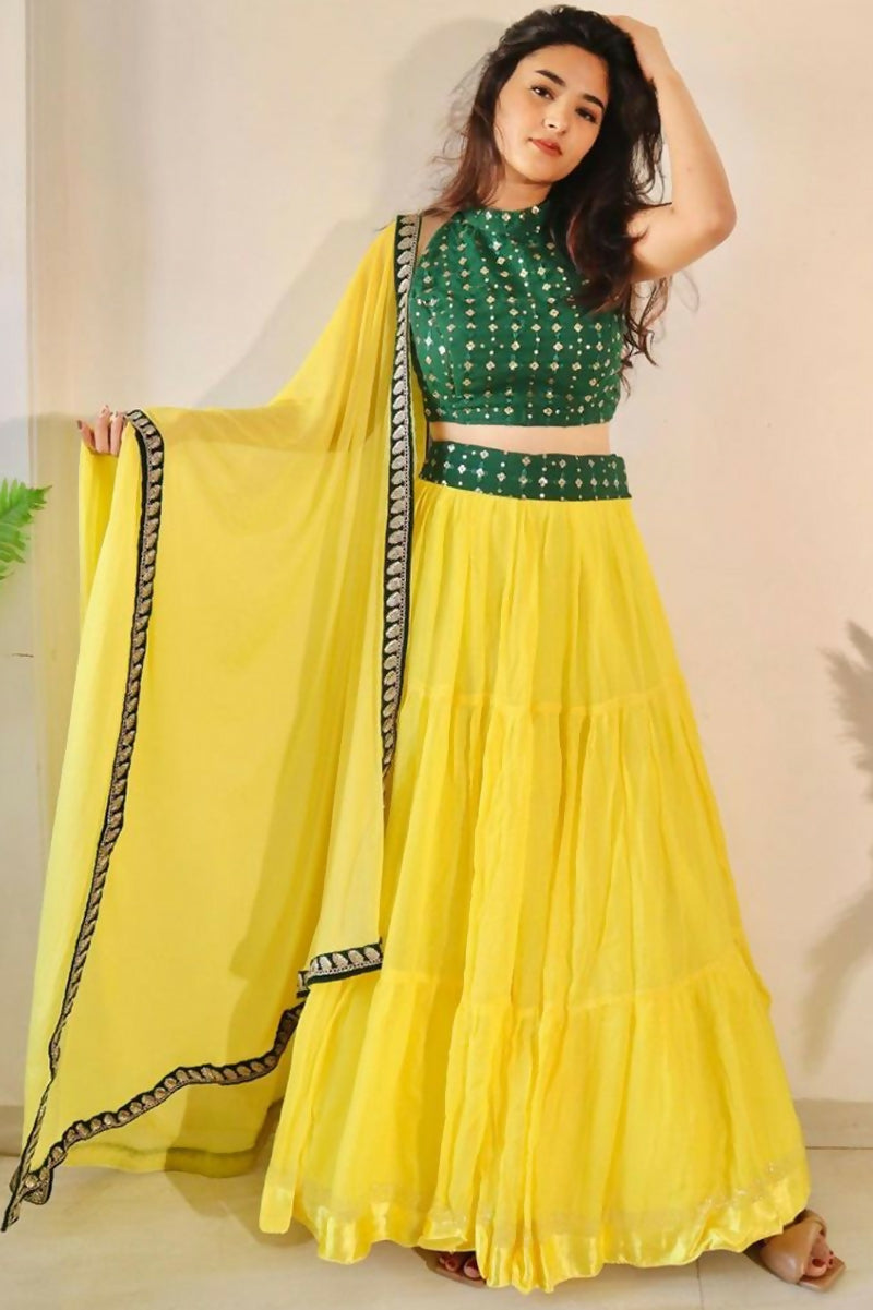 Yellow georgette lehenga choli featuring three-layer frill stitching and a designer silhouette.