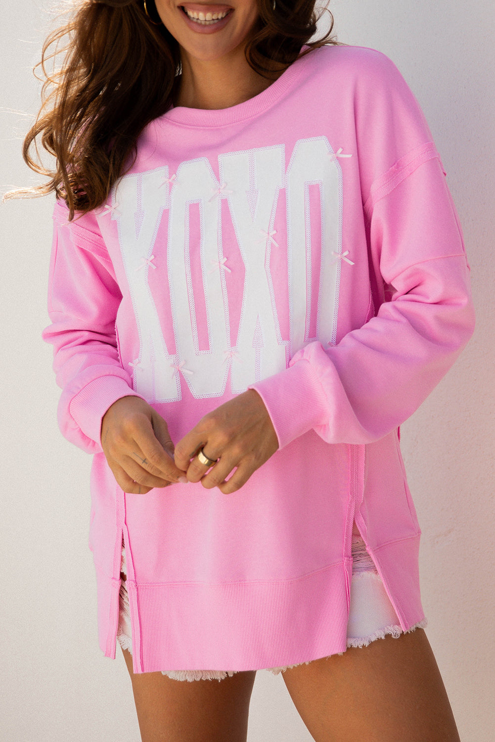 Pink Bow Sequin XOXO Baggy Sweatshirt | Exposed Seam Detail