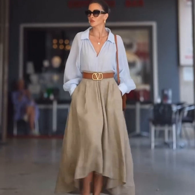 A minimalist light khaki A-line midi skirt, perfect for casual street fashion outfits.