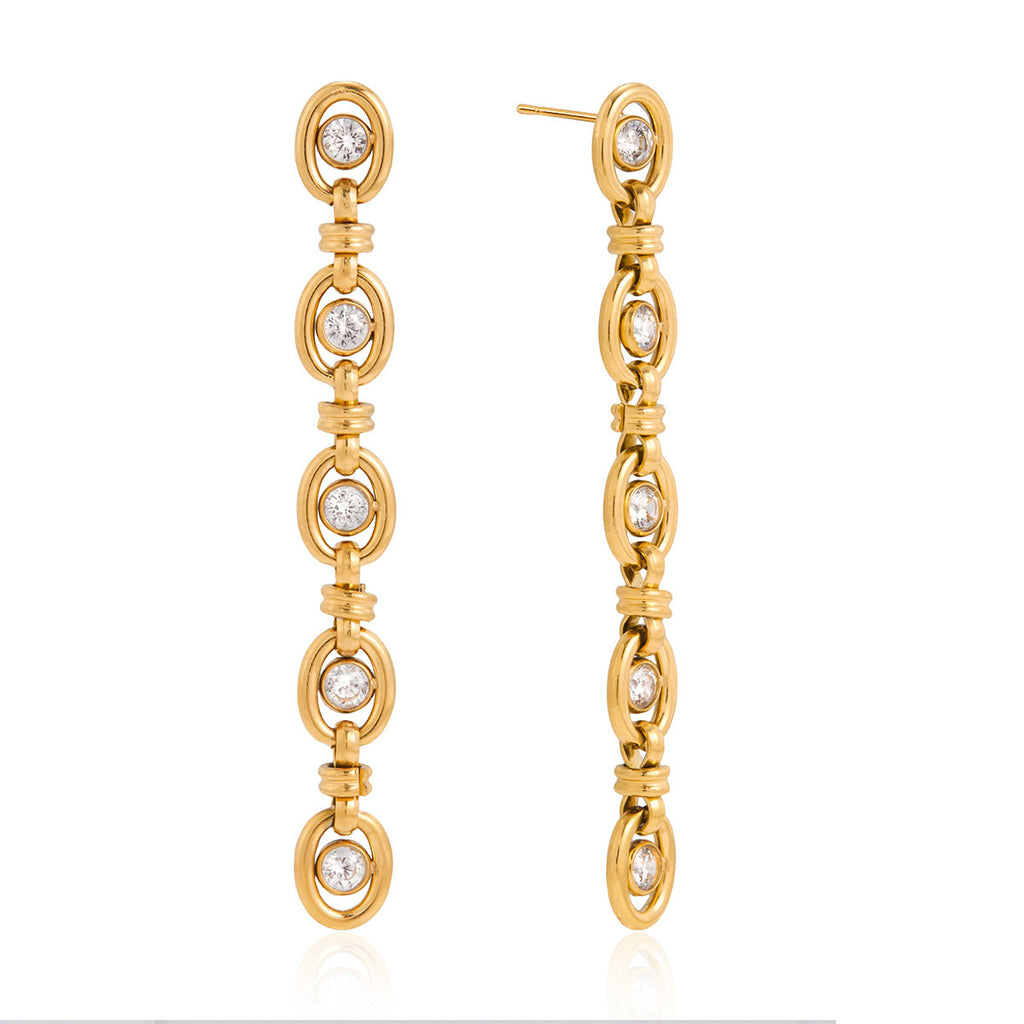 Modern gold-tone geometric zircon chain tassel earrings and matching bracelet set.
