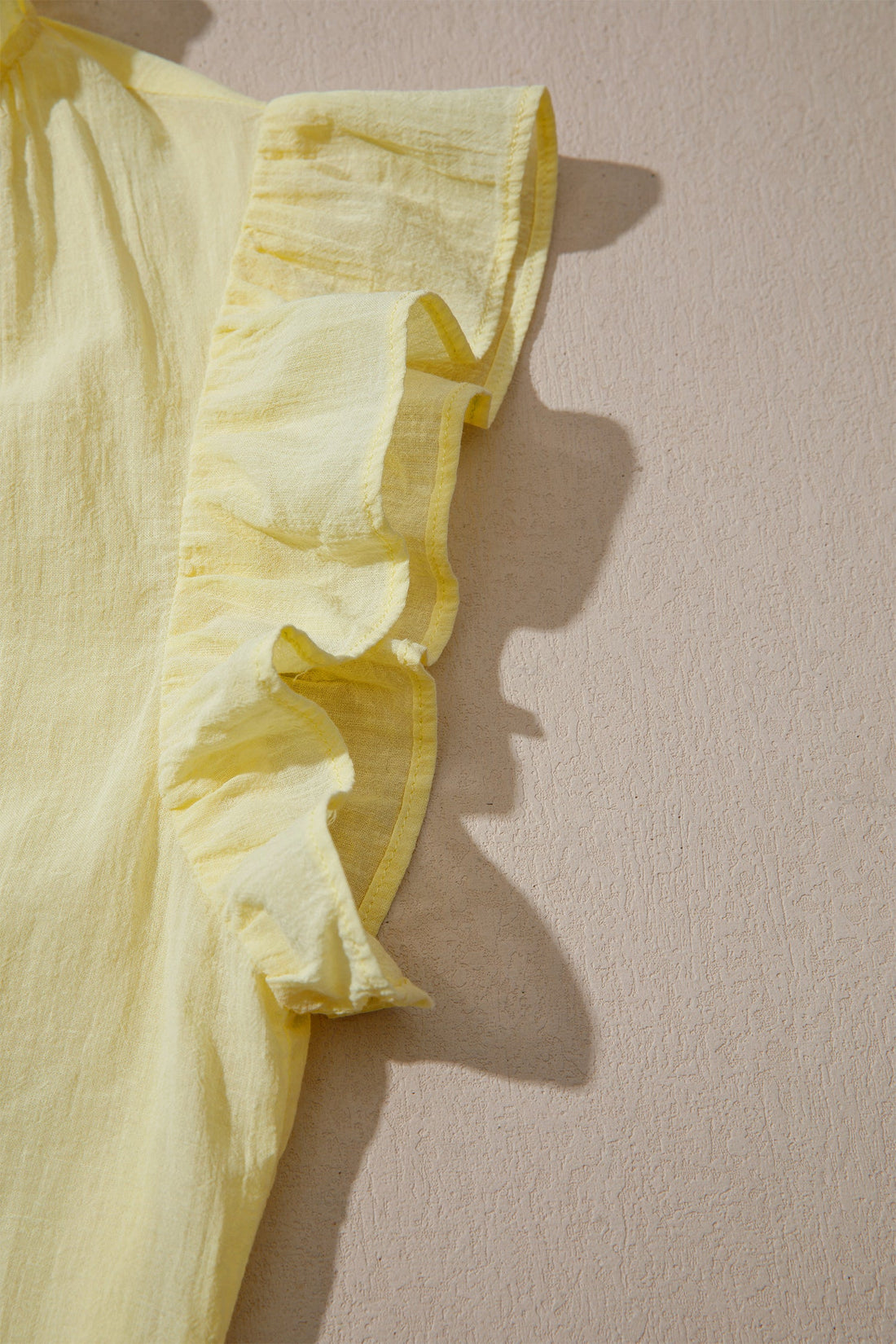 Solid V-Neck Sleeveless Top with Ruffle Trim in Yellow