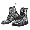 Pair of black and white camouflage lace-up canvas boots with black soles and laces, displayed on a white background.