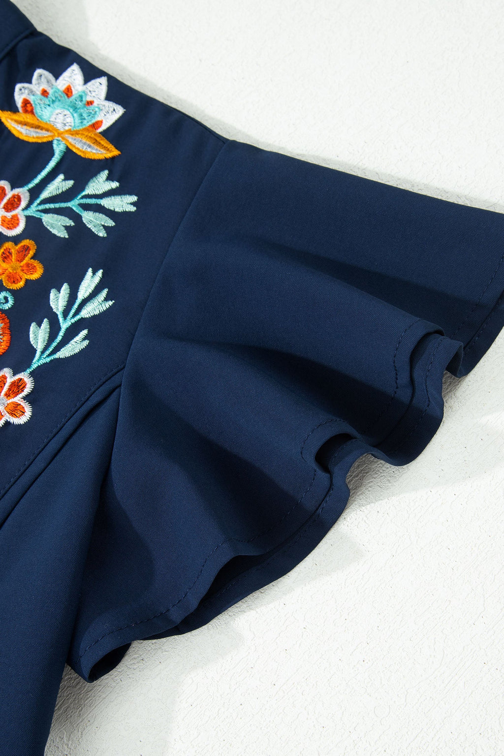 Embroidered Babydoll Blouse with Notched Neck and Ruffle Sleeves