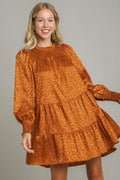 Smocked leopard print long sleeve tiered dress in rust and bronze satin