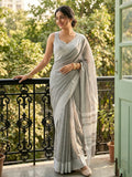 Sophisticated gray linen saree with matching blouse piece.