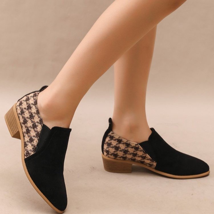 Women's brown and black houndstooth pattern slip-on block heels with suede-texture front panels.