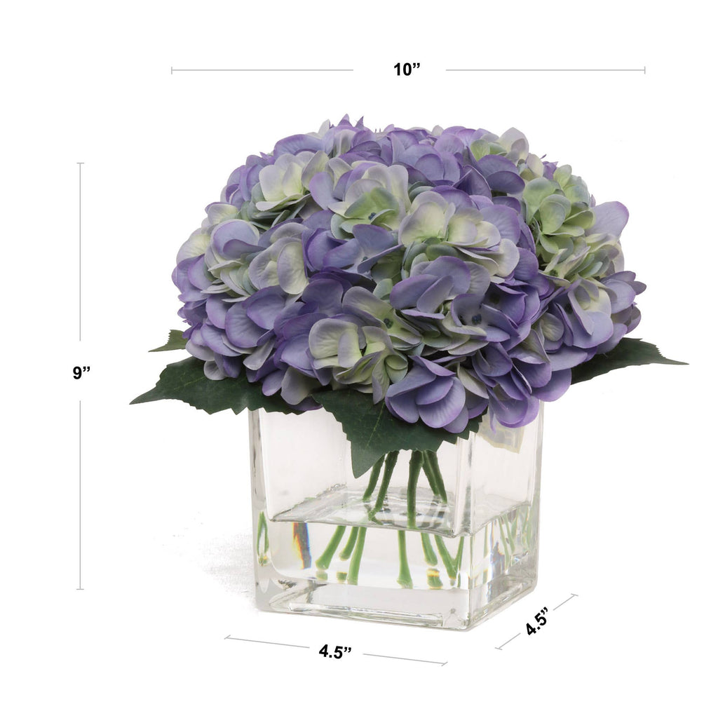 Blue Hydrangea Flowers In Glass Vase With Water Look