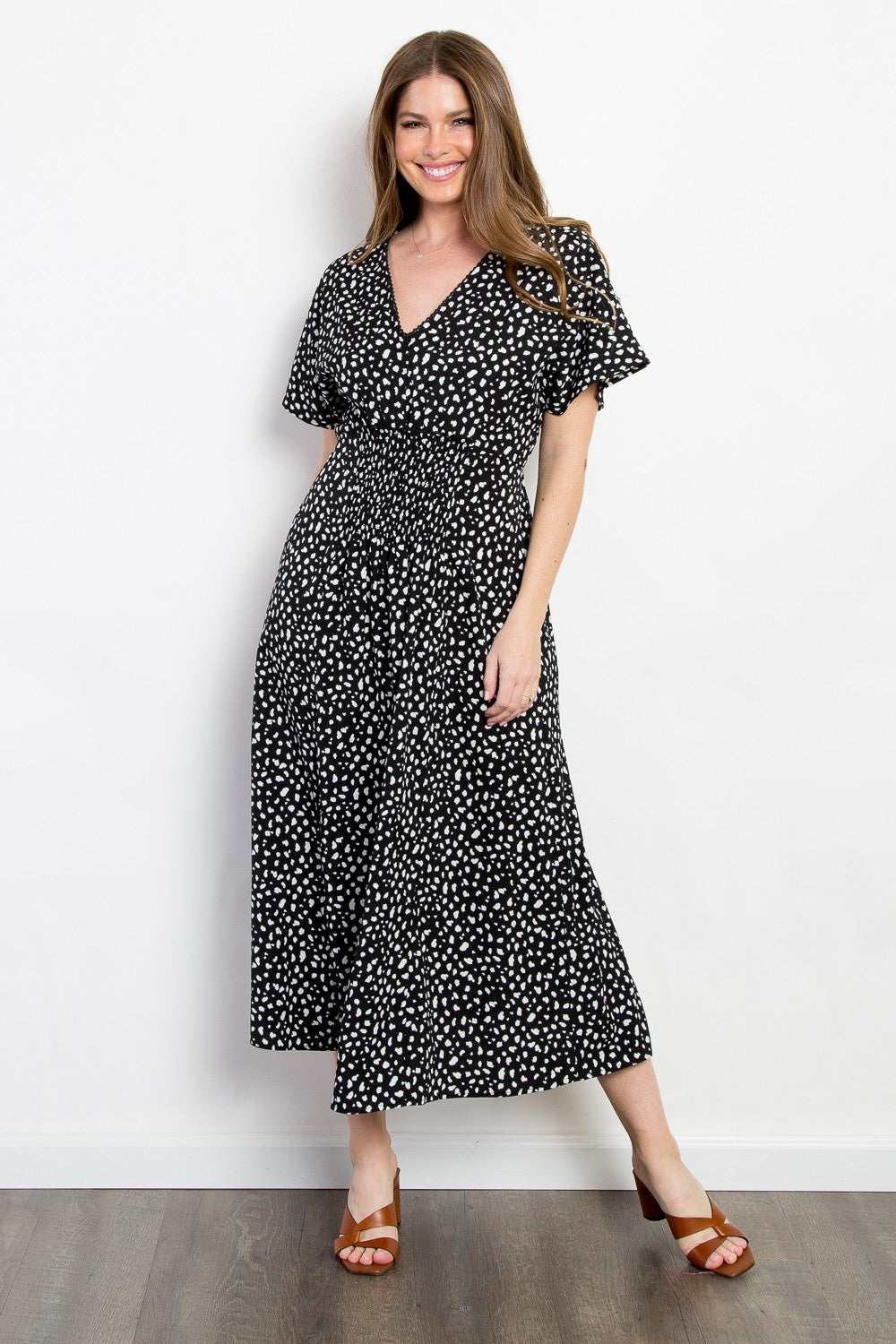 Chic printed dress featuring a flattering smocked waist detail