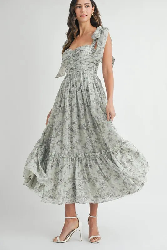 Floral print midi dress with ruched bust and shoulder tie straps.