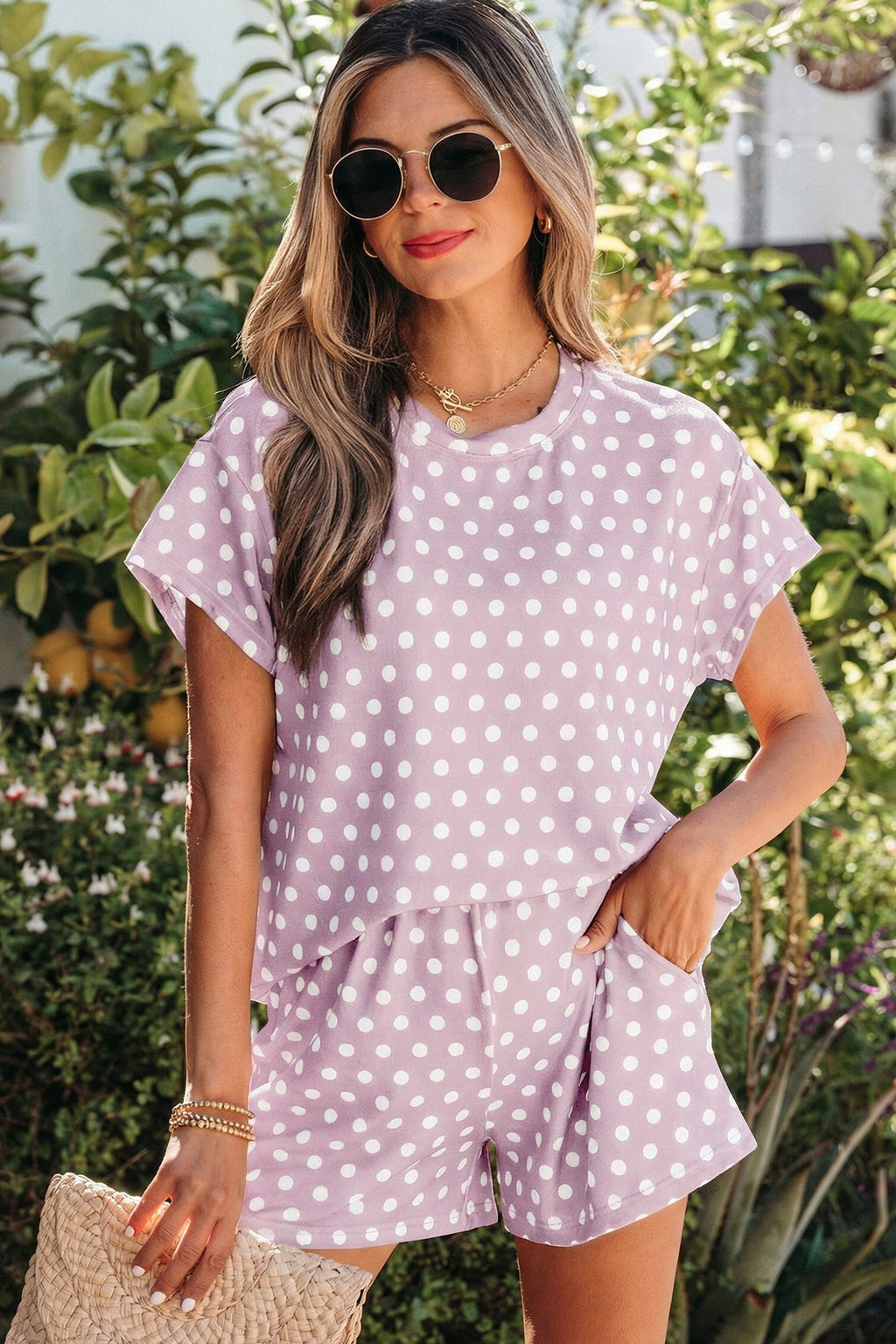 A two-piece short set in a purple polka dot print featuring a comfortable relaxed-fit top and matching shorts.