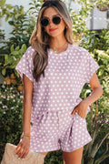 A two-piece short set in a purple polka dot print featuring a comfortable relaxed-fit top and matching shorts.
