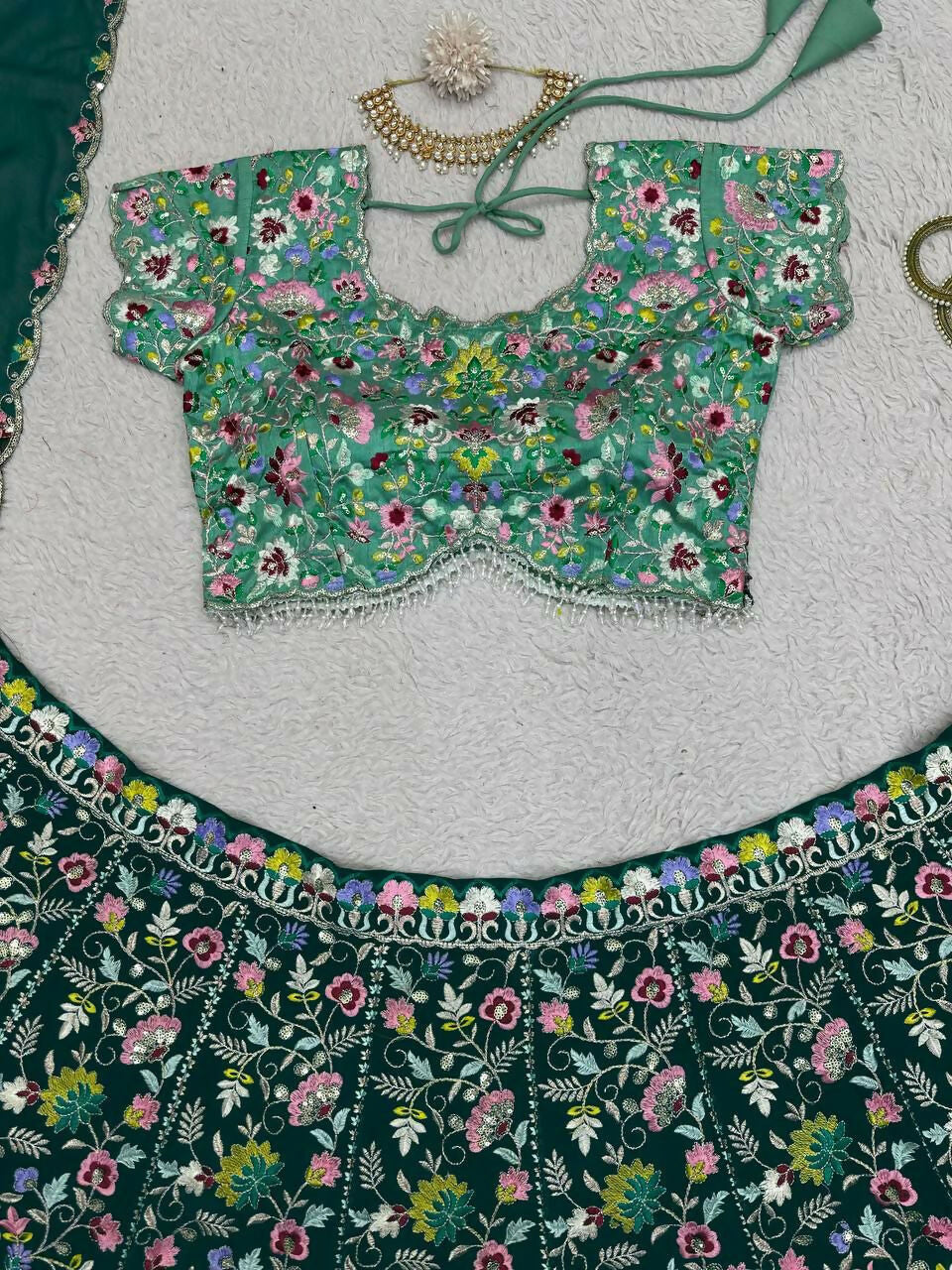 Bottle Green Faux Georgette Lehenga Choli with Sequins Embroidery