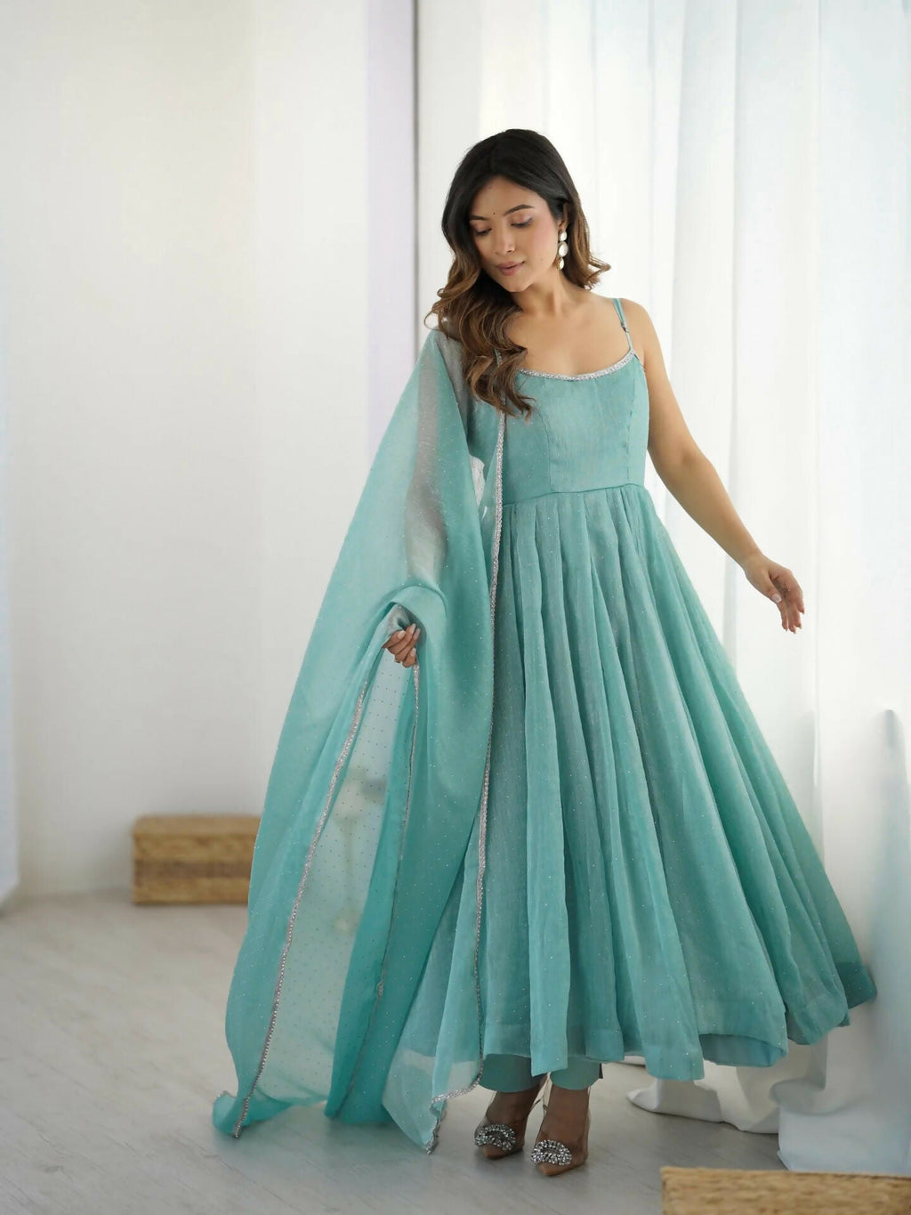 Elegant sky blue silk kurta set featuring intricate sequence embroidery and matching dupatta