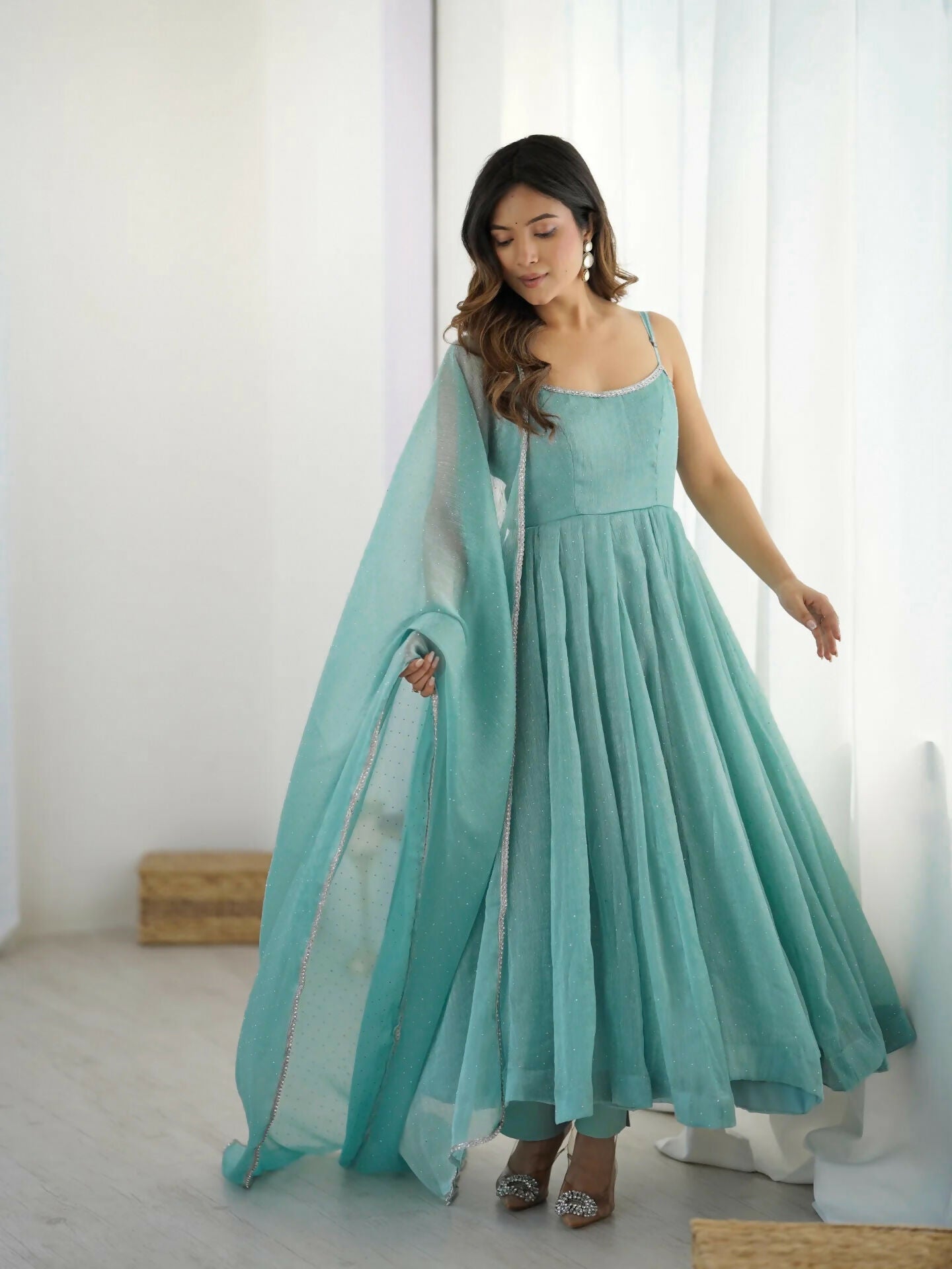 Elegant sky blue silk kurta set featuring intricate sequence embroidery and matching dupatta