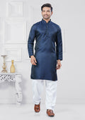 Toddler boy wearing a navy blue jacquard silk kurta pyjama set