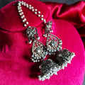 A pair of traditional Joban Fashion oxidised black metal Jhumka earrings with intricate Sahara chain design.