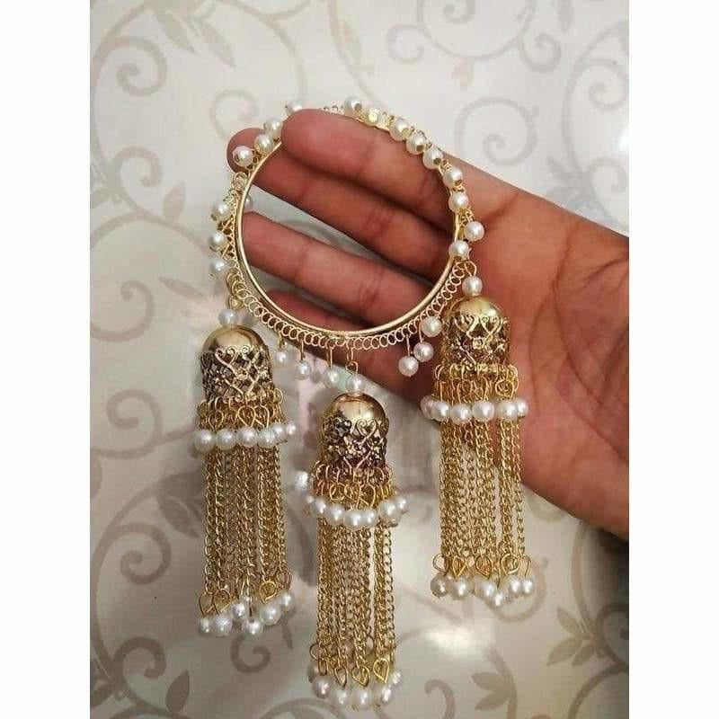 Gold-tone bangle set with hanging jhumkas and white pearls for festive wear