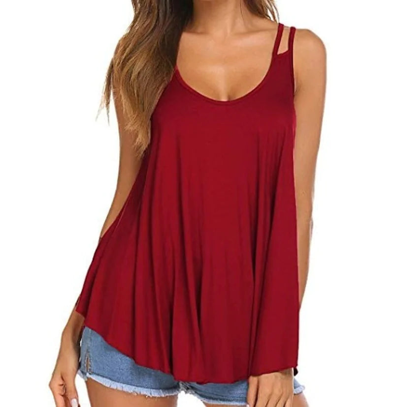 A woman wearing a solid color sleeveless tank top with a scoop neck and flowy pleated design.