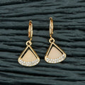 Elegant Brass Golden White AD stone earrings featuring a sparkling finish.
