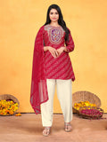 Model wearing a vibrant red pure viscose Dola silk kurta set with detailed handwork and cotton lining