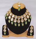 Traditional Green Kundan necklace with gold plating and adjustable cord.