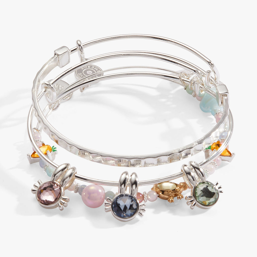 Set of 3 expandable wire bangles featuring bunny charms with colored crystals, crystal carrots, and enamel eggs