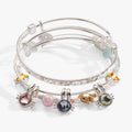 Set of 3 expandable wire bangles featuring bunny charms with colored crystals, crystal carrots, and enamel eggs