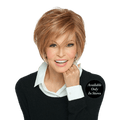 A stylish woman wearing the Easy Does It short wedge wig in a natural brown shade.