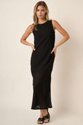 Minimalist black sleeveless round neck dress with side slit detail