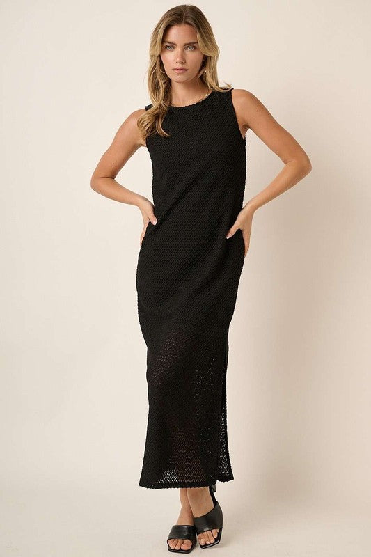Minimalist black sleeveless round neck dress with side slit detail