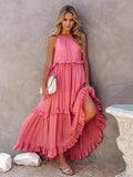 Flowy sleeveless maxi dress with tiered ruffles and side pockets.