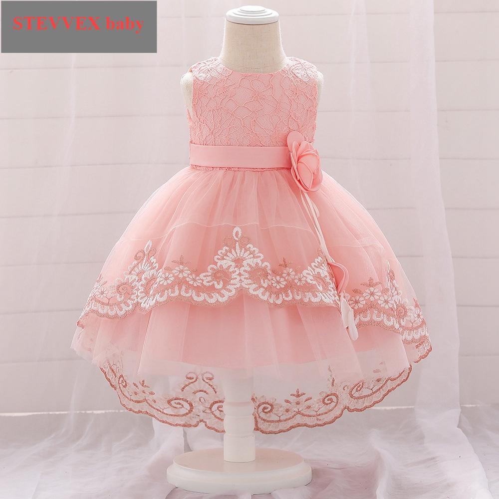Baby girl wearing an embroidered lace gown with a soft cotton lining for comfort