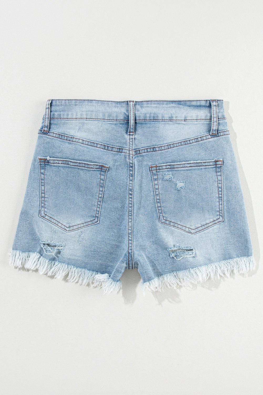 Distressed Denim Raw Hem High Waist Shorts in Light Blue