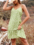 Model wearing a light green mini dress with a white daisy floral print and a V-neckline.