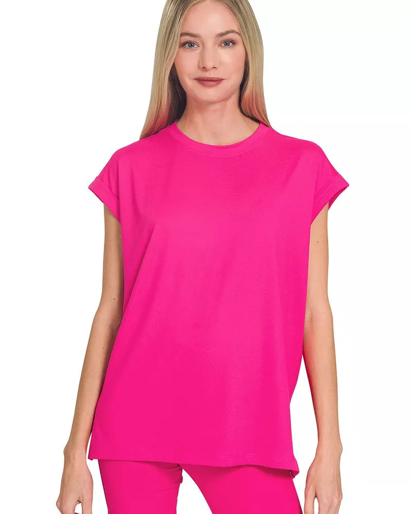 Woman wearing a bright pink outfit on a white background