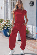 Model wearing a Racing Red cropped tank top and matching jogger pants set