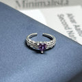 High grade purple stone open band ring with a modern designer aesthetic