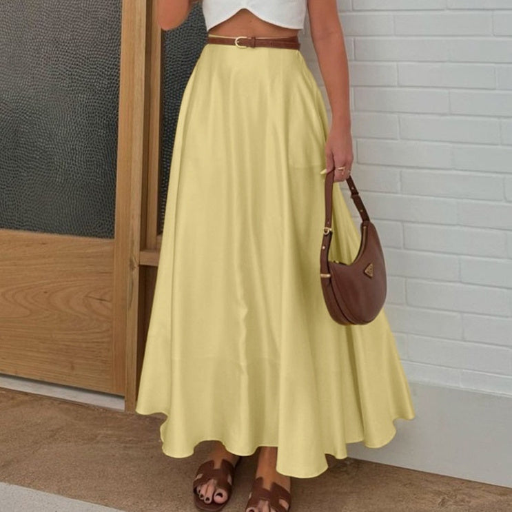 Yellow polyester satin hip skirt with zipper detail styled for a professional commute look