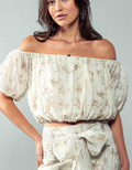 Woman wearing an Elastic Off Shoulder Floral Crop Blouse in Taupe, styled with high-waisted bottoms