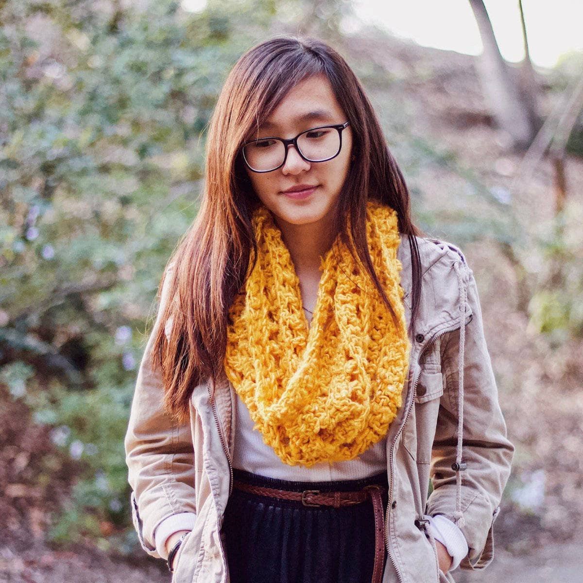Vibrant mustard yellow ribbed banana fiber cowl worn in a casual bohemian setting