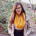 Close-up of the Elderidge Ribbed Banana Cowl crochet project featuring textured fiber detail.