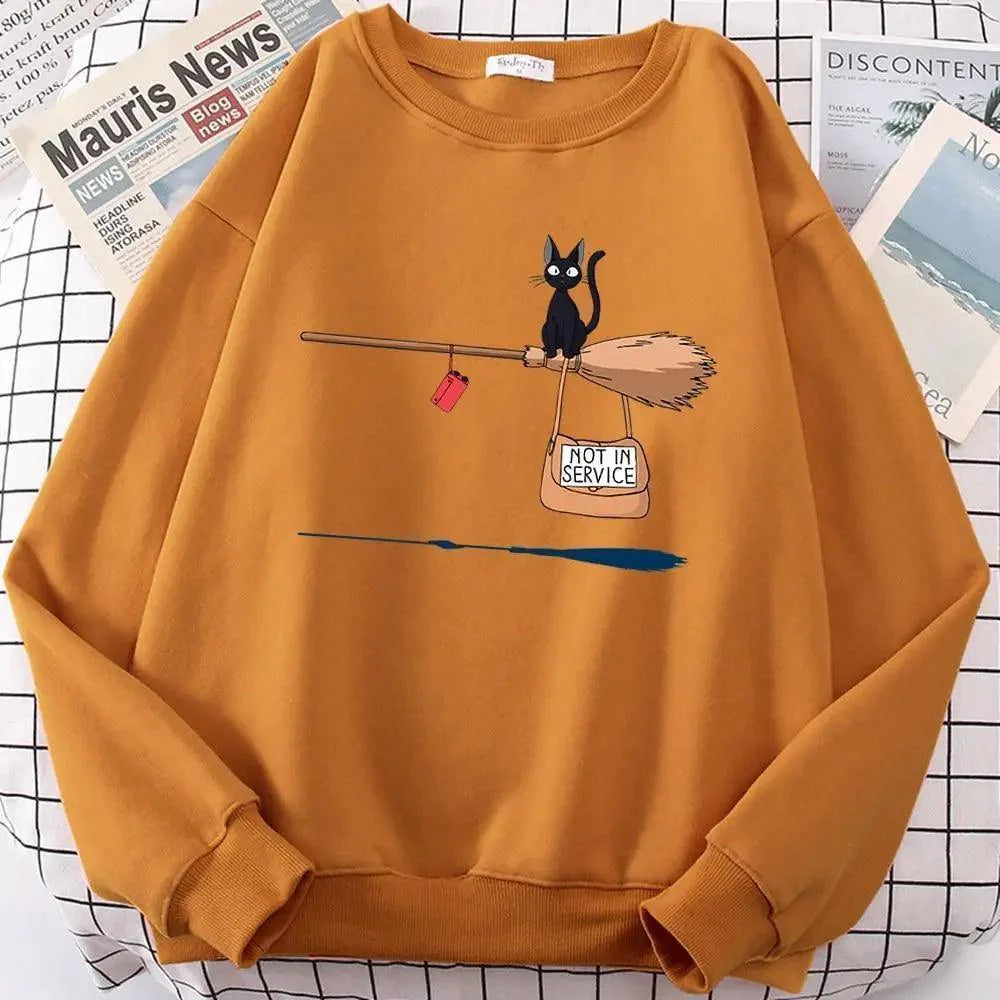 Women wearing a casual, loose-fit grey crewneck sweatshirt featuring a cute cat print graphic.