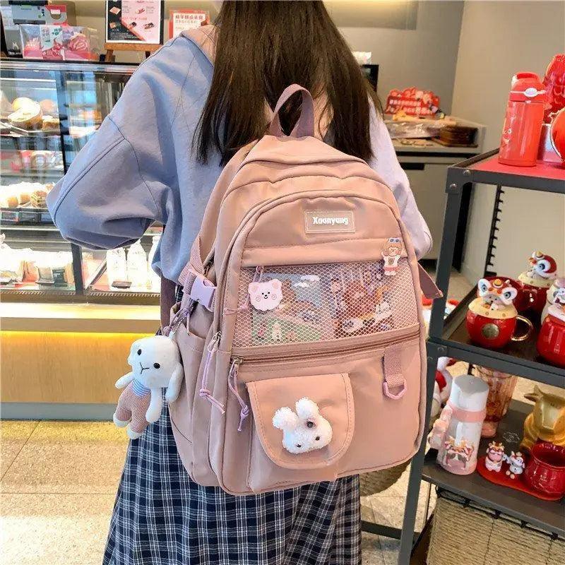 Sleek mini leather backpack for women featuring polished gold-tone hardware and organized interior compartments.