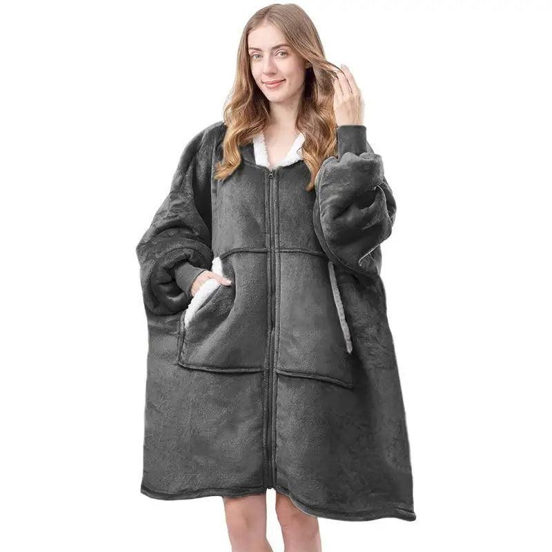 An oversized fleece wearable blanket hoodie with sleeves, designed for maximum comfort and warmth.